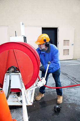commercial plumber hydro line jets a pipe at a large restaurant