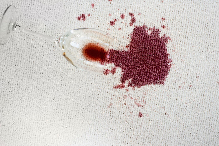 Close up of spoiled red wine on white background