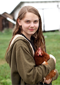 Girl Carrying Hen
