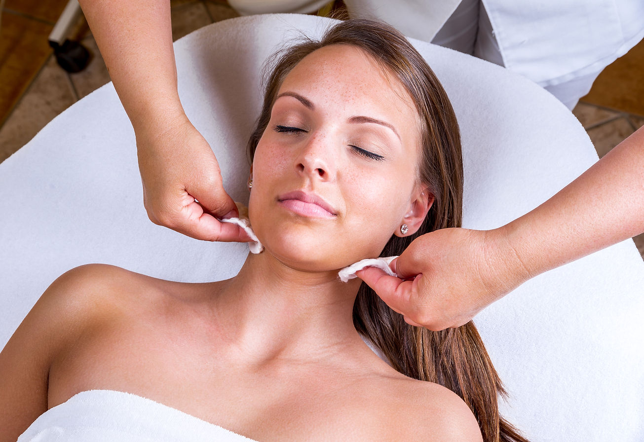 Freckles woman having a cosmetic treatment at the beauty salon