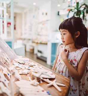 A girl looking at souvenirs.pg