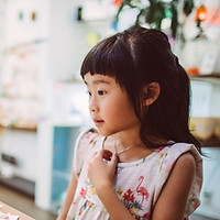 A girl looking at souvenirs.pg