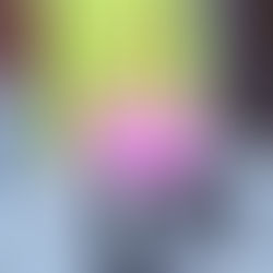 Close of of a person walking wearing a lime green coat and a pink bag