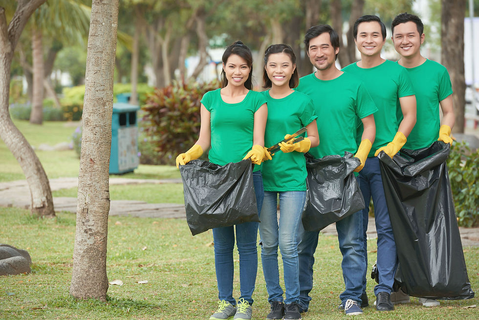 Group of Asian volunteering for collecting garbage in the park