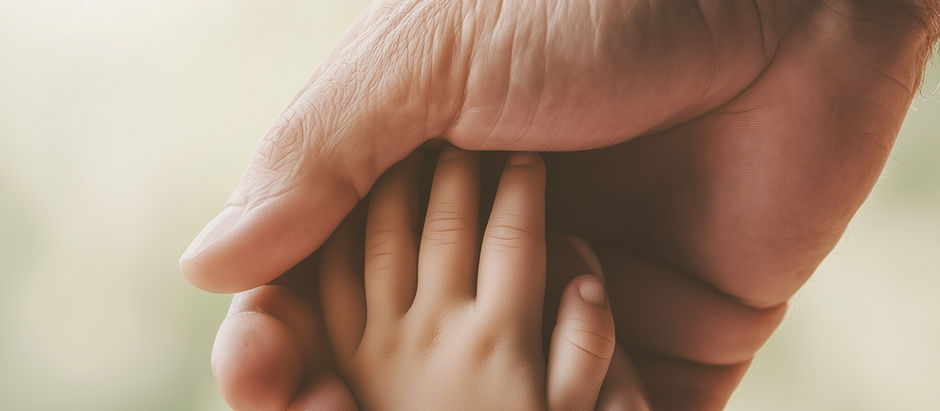 Holding hands symbolizing a father comforting his child