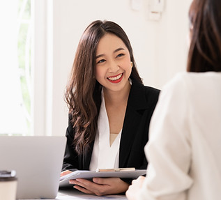A woman smiling while working