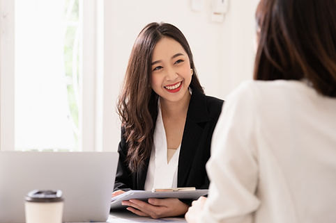A woman smiling while working