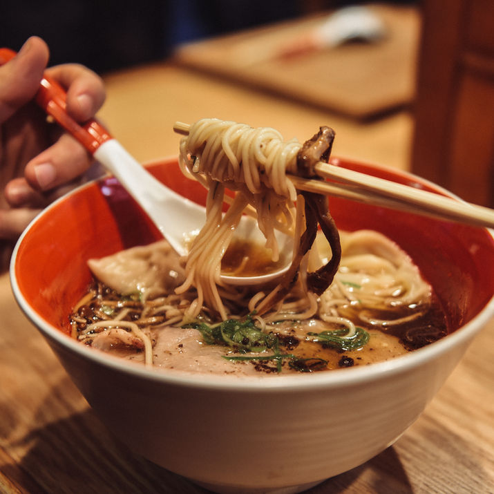 Delicious ramen noodles lifted with chopsticks