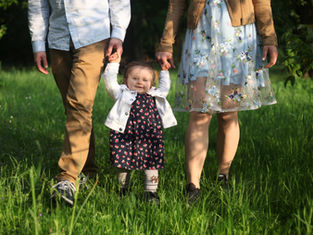 a child happy with her parents