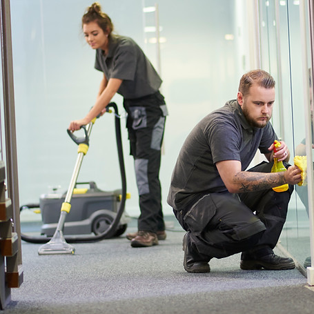 Cleaning professionals in office