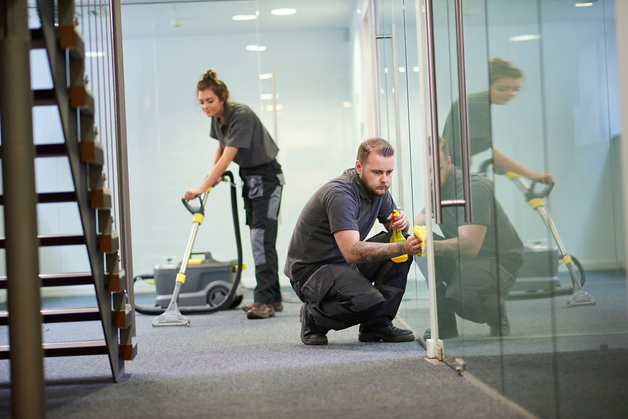Professionals cleaning cleaning a bright office space