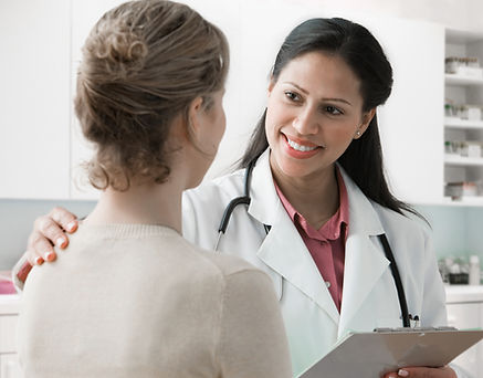 Doctor talking with a female patient during a well-woman visit