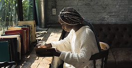 A Woman Writing by the Window
