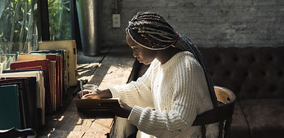 A Woman Writing by the Window