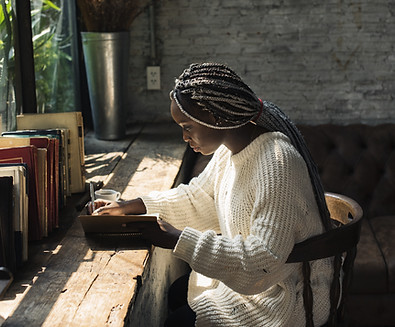 A Woman Writing by the Window