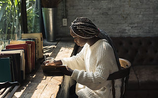 A Woman Writing by the Window