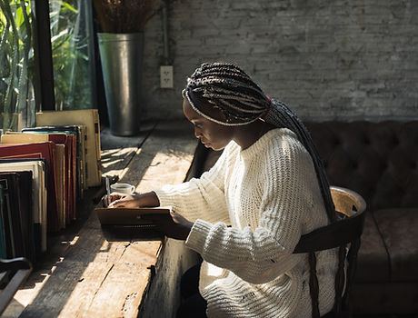 A Woman Writing by the Window