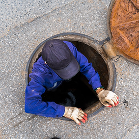 Worker in Manhole