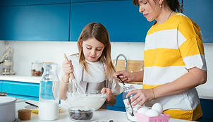 Mother And Daughter Baking