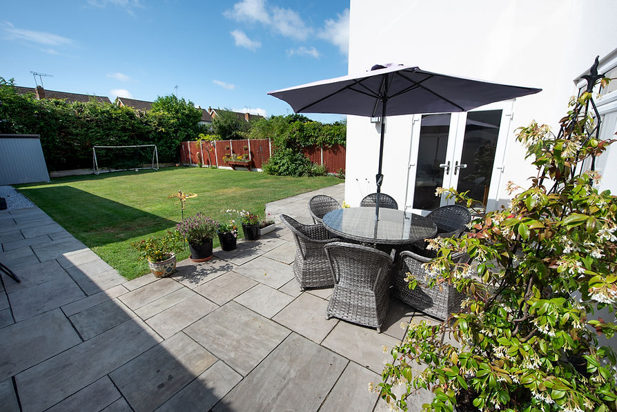 patio area with furniture in house garden