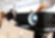 A projector in focus with a blurred background