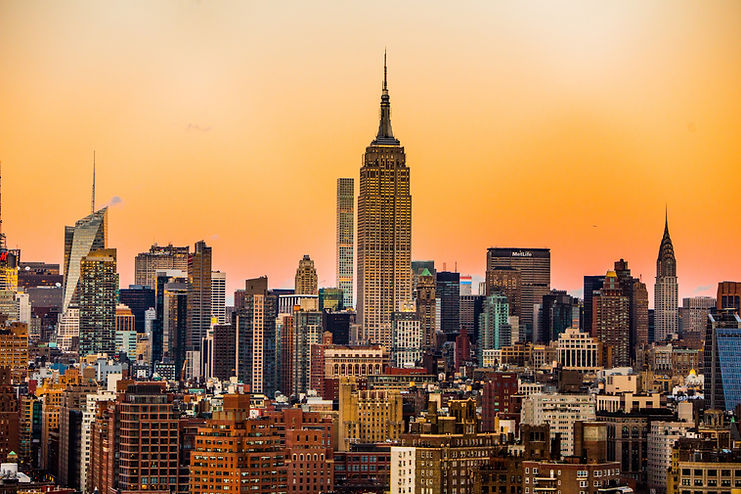City skyline at sunset used as a decorative background for a financial responsibility quote
