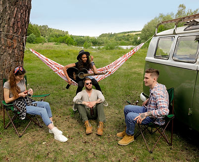 Group of young adult friends outside of a campsite