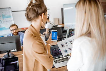 In a collaborative office setting, professionals focus on balancing personal data protection with corporate transparency, highlighting secure technology solutions.