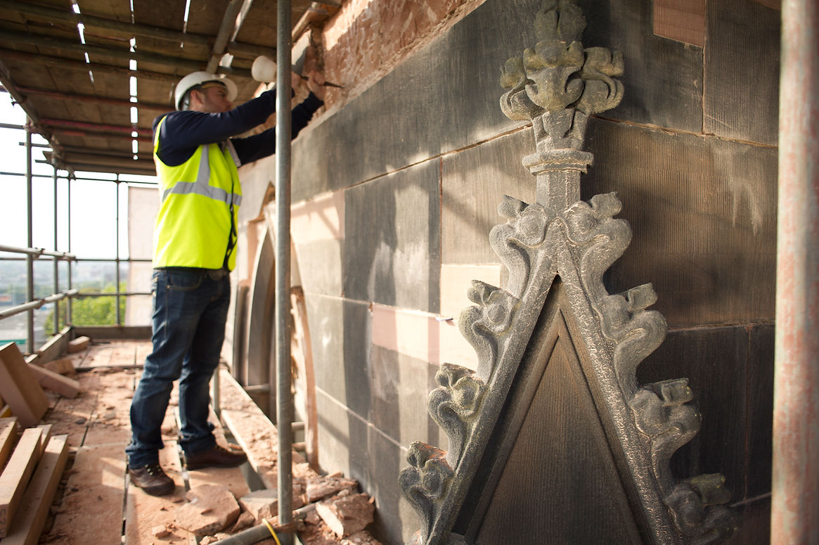Church being restored by stonemason