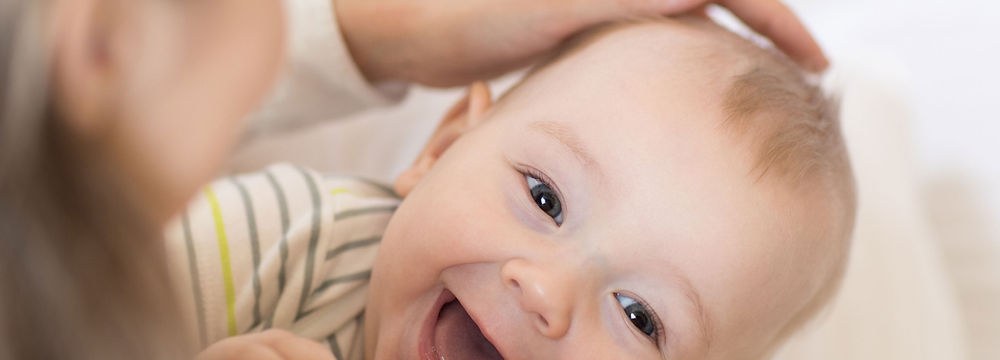 parents play blocks with happy child