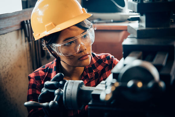 A woman working with steel