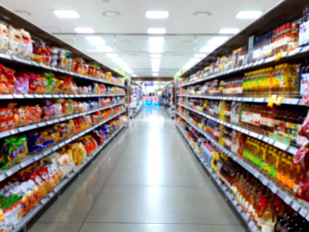 An American buyer inspects sugarcane bagasse tableware samples at an Indian manufacturing unit.