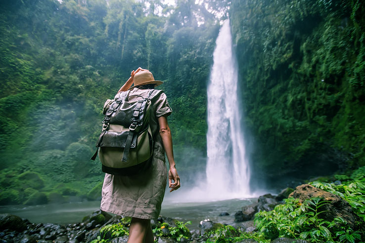 Explorer Near Waterfall