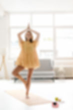 Woman Practicing Yoga Indoors
