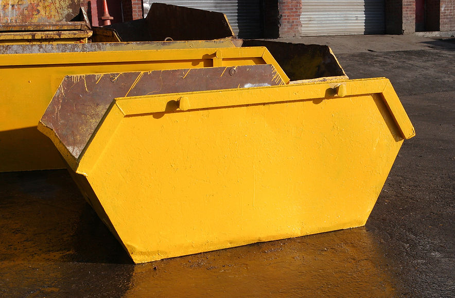 empty yellow skip
