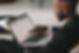 A man pointing at his laptop screen