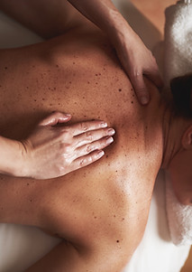 Woman recieving a back massage.