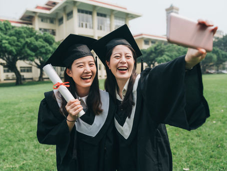 2 graduates ladies posing for a photo