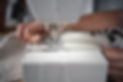 Close-up of a person's hand and sewing machine