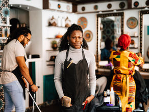 a woman in a busy hair salon