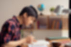 Vietnamese teenager boy doing homework