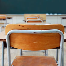 Empty School Desks And Chairs
