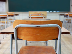 Empty School Desks And Chairs