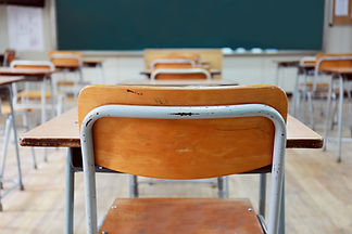 Empty School Desks And Chairs