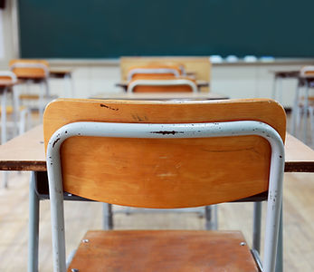 Empty School Desks And Chairs