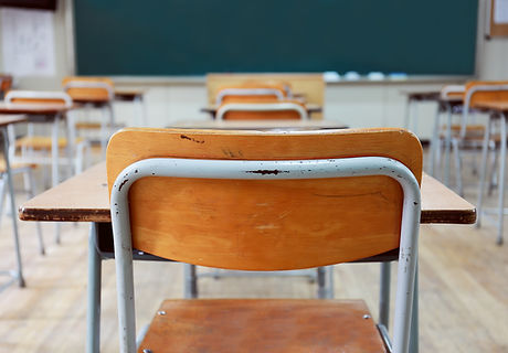 Empty School Desks And Chairs