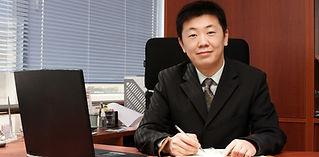 Person Sitting Behind Desk