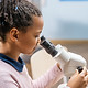 Girl Using Microscope