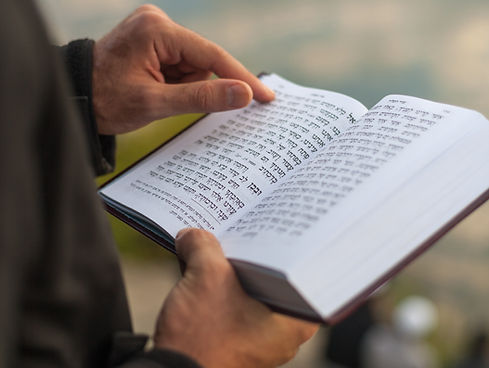Holding a Prayer Book