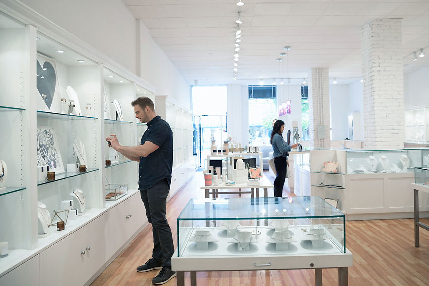 Customer browsing jewellery display in boutique